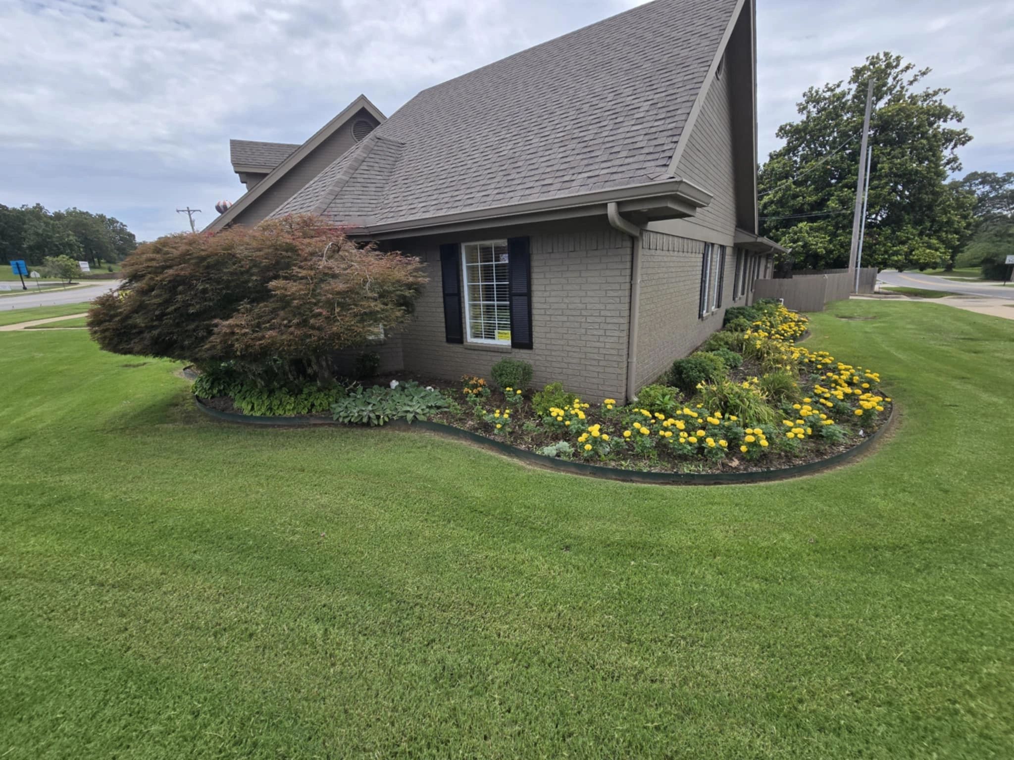 Brick home with professional landscaping